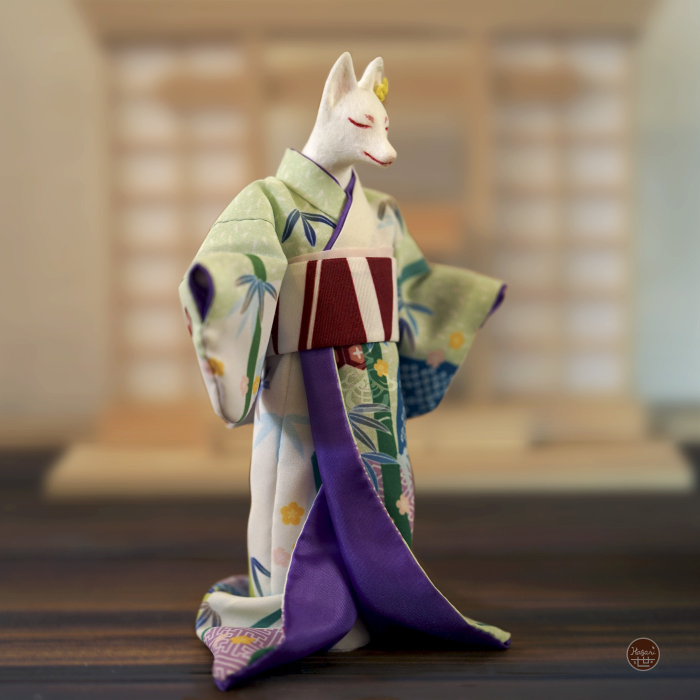 Kimono-wearing fox figure with purple inner kimono lining and bamboo-patterned fabric