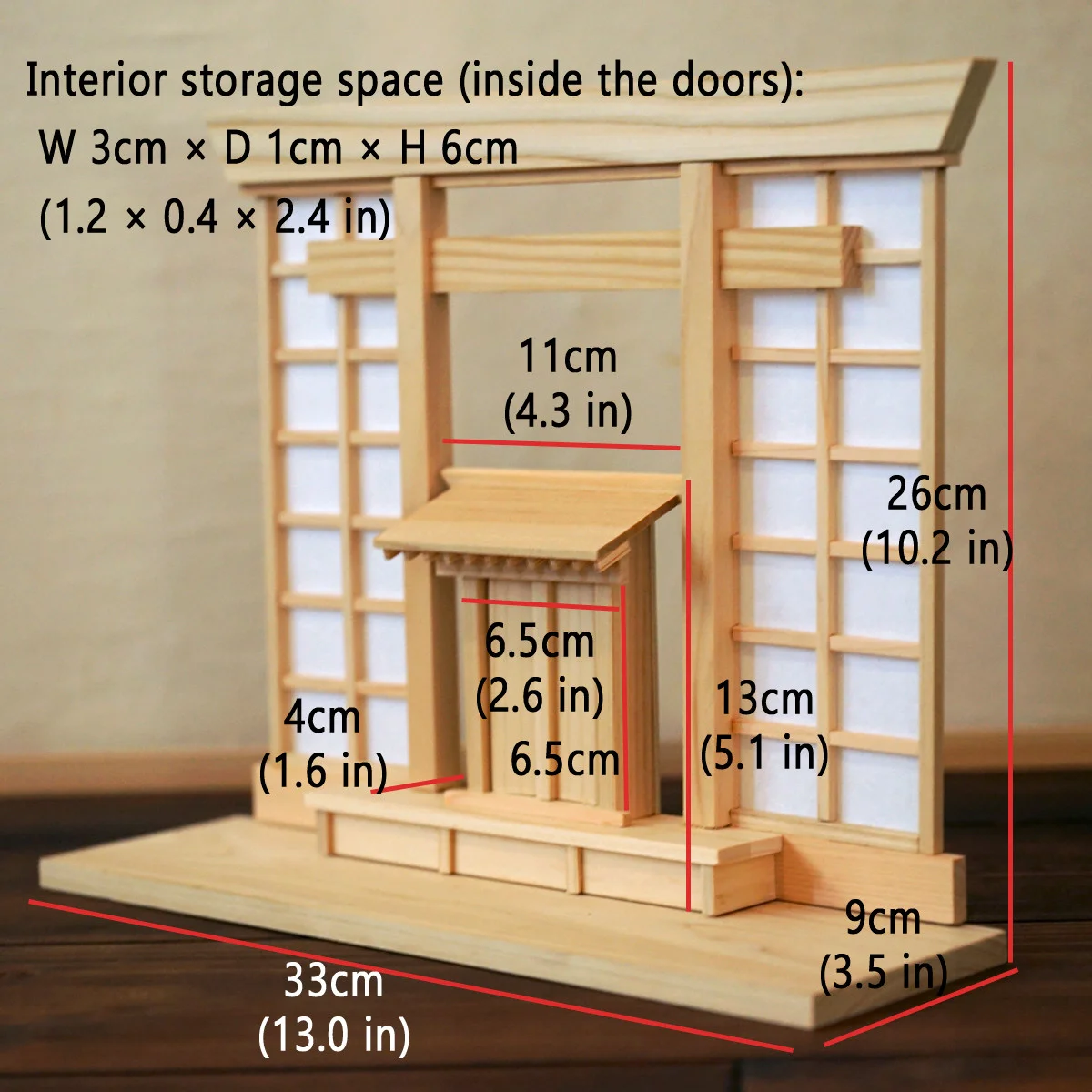 Hinoki wooden display stand with a torii-like shape, shoji-style background, and small double doors at the center