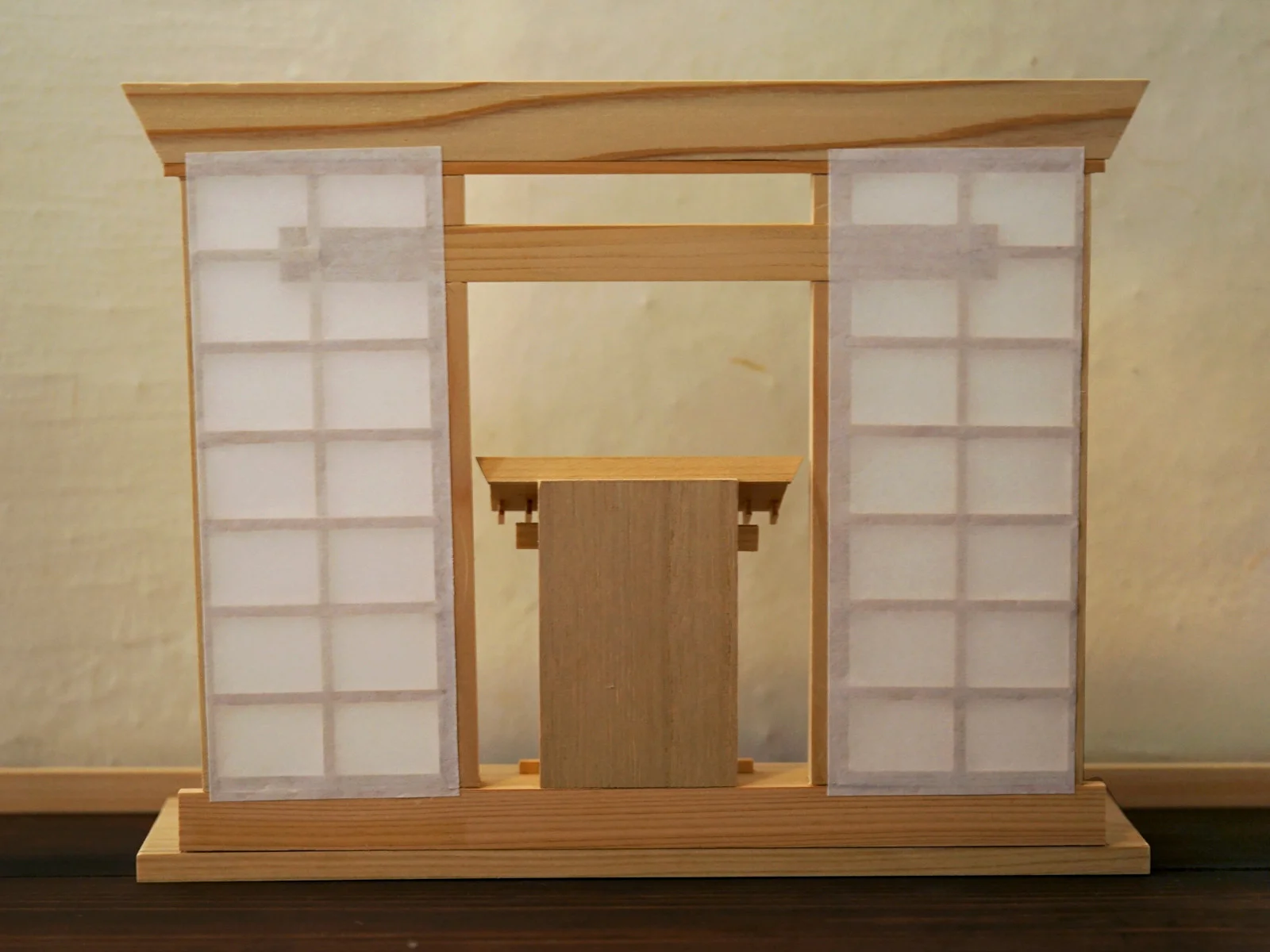 Back view of the hinoki wooden display stand with durable washi paper attached to the lattice panels