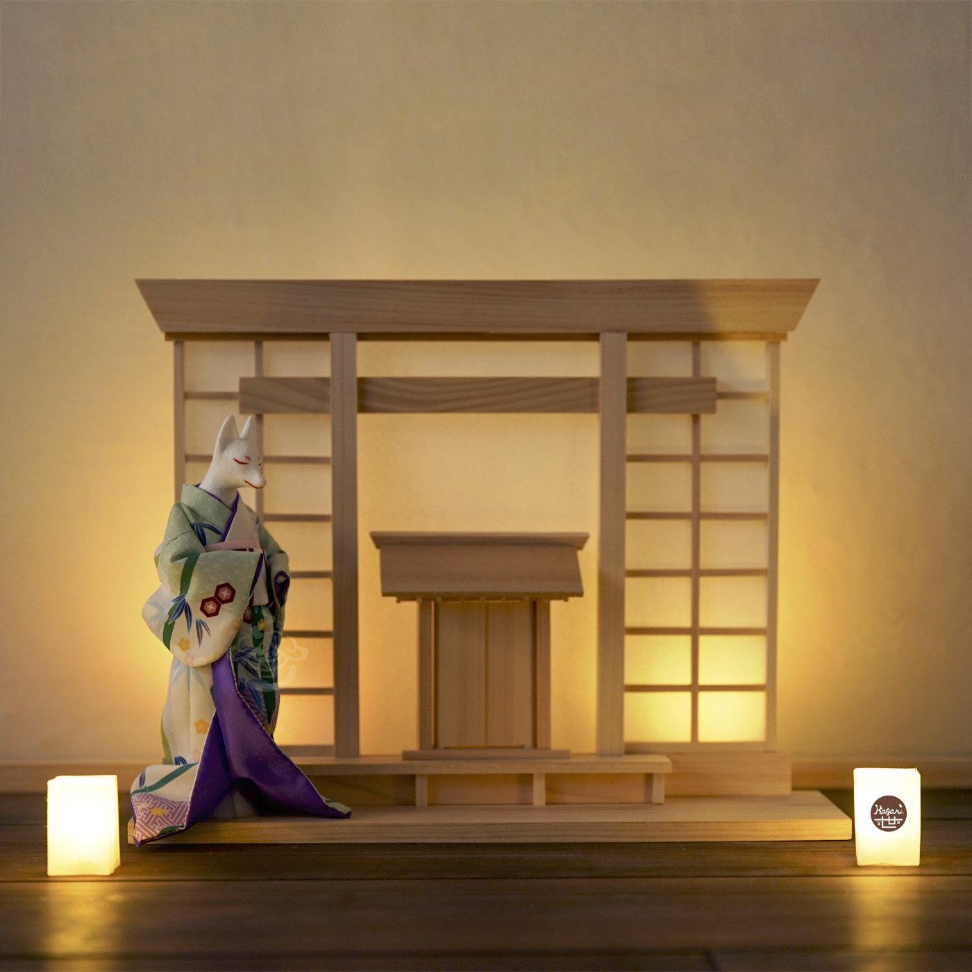 Kimono-wearing fox figure standing before a shrine-inspired wooden display, softly lit through shoji-like washi panels with small washi paper lamps in the foreground